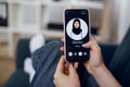 Close-up of hand of unrecognizable female patient, holding cell phone and having video conference with her Arabian Royalty Free Stock Photo