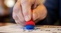 Close-up of Hand Using Bingo Dauber on Card Royalty Free Stock Photo
