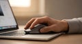 Close up hand using computer mouse on laptop keyboard for productive work or browsing Royalty Free Stock Photo