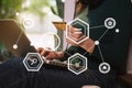 Close up of Hand using credit card and smartphone, laptop computer on wooden desk with VR icon chart graph diagram