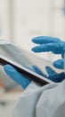 Close up of hand using dental x ray on modern tablet