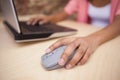 Close up of a hand using a grey mouse Royalty Free Stock Photo