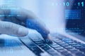 Close up of hand using laptop at desktop with abstract glowing blue coding background. Binary code, technology, data and internet Royalty Free Stock Photo