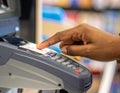 Close-up of Hand Using Point of Sale Terminal in Retail Store Royalty Free Stock Photo
