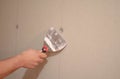 Drywall Surface Repair with Putty Knife Royalty Free Stock Photo
