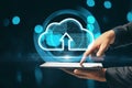 Close up of hand using tablet with creative glowing clouds hologram on blurry binary code background. Cloud computing and database Royalty Free Stock Photo