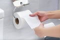 Close-up of Hand Using Toilet Paper. Royalty Free Stock Photo