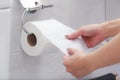 Close-up of in Hand using a toilet paper Royalty Free Stock Photo