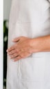 Close-Up of Hand on Waist in Light-Colored Garment Royalty Free Stock Photo