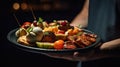 Close up on the hand of a waiter carrying food presentation in restaurant