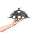 Close up hand of waiter with metal cloche lid cover and tray Royalty Free Stock Photo