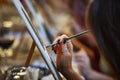 Close-up of a hand of a woman artist painting a picture with a t Royalty Free Stock Photo