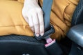 Close up hand of woman fasten seat belts before diving car for protection and safety Royalty Free Stock Photo