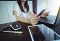 Close up of hand woman holding credit card,mobile phone and using laptop Royalty Free Stock Photo