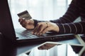 Close up of hand woman holding credit card and using laptop for online shopping concept Royalty Free Stock Photo