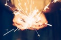 Close up hand woman holding sparklers in night party and christmas celebration Royalty Free Stock Photo