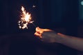 Close up hand woman holding sparklers in night party and christmas celebration Royalty Free Stock Photo