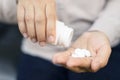 Close up hand woman holding taking multiple pills. Royalty Free Stock Photo