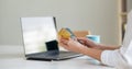 Close up hand of woman making card payment through mobile phone to pay bills Royalty Free Stock Photo