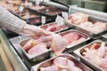 Close-up hand woman shopping for chicken meat in a store Royalty Free Stock Photo