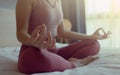 Close-up hand of woman in sportsware practice yoga lotus pose to meditation at home, Wellness woman doing yoga for breathing and Royalty Free Stock Photo