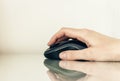 Close-up of hand woman using a computer mouse on glass table, business concept Royalty Free Stock Photo