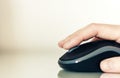 Close-up of hand woman using a computer mouse on glass table, business concept Royalty Free Stock Photo