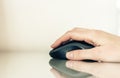 Close-up of hand woman using a computer mouse on glass table, business concept Royalty Free Stock Photo