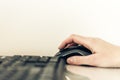 Close-up of hand woman using a mouse and typing on keyboard computer on glass table, business concept Royalty Free Stock Photo