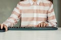 Close-up of hand woman using a mouse and typing on keyboard computer on white table, business concept Royalty Free Stock Photo