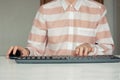 Close-up of hand woman using a mouse and typing on keyboard computer on white table, business concept Royalty Free Stock Photo