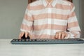 Close-up of hand woman using a mouse and typing on keyboard computer on white table, business concept Royalty Free Stock Photo