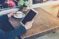 Close up hand woman using tablet in coffee shop Royalty Free Stock Photo