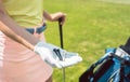 Close-up of the hand of a woman holding three tees on a golf course