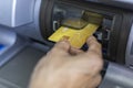 Close up hand of women with a credit card, using an ATM. Women using an atm machine with his credit card. Hand holding credit card Royalty Free Stock Photo