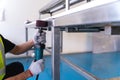 Close up of hand Worker use Electric wheel grinding on Polishing of varnish after painting the Aluminum on product sorting machine