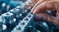 Close-up of a hand working on an engine, adjusting parts in a mechanical setting. Precision engineering and maintenance concept