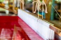 Close Up Hand Woven Cotton Weaver Machine Loom with Red Silk Thread for made Fabric