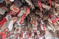 Close up of hand written prayers hanging on a roof.