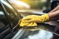 Close up of hand in yellow gloves cleaning car window with microfiber cloth, Male Worker hand close up Cleaning Car Dashboard, AI Royalty Free Stock Photo