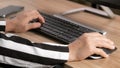 Close up Hand of young business woman working on a laptop computer sit at desk in her office Royalty Free Stock Photo