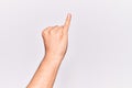 Close up of hand of young caucasian man over isolated background showing little finger as pinky promise commitment, number one Royalty Free Stock Photo