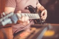 Close up hand of young man playing on a professional, black electric guitar, music instrument, entertainment, lifestyle Royalty Free Stock Photo