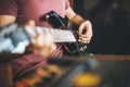 Close up hand of young man playing on a professional, black electric guitar, music instrument, entertainment, lifestyle Royalty Free Stock Photo