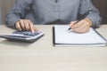 Close up hand young man are sitting on a marble chair. using pen writing Record Royalty Free Stock Photo