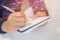 Close up hand young man are sitting using pen Royalty Free Stock Photo