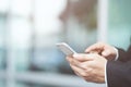 Close up hand young man in watching message on mobile smart phone during break. using cell phones to communicate in the online w Royalty Free Stock Photo