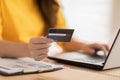 Close up hand of young woman using credit card for pay online shopping on computer laptop.Hand typing credit card number to buying Royalty Free Stock Photo