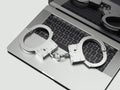 Close up of handcuffs on laptop isolated on white background, 3d rendering.