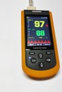 Close up handheld pulse oximeter medical devices use to monitor blood oxygen in patients in emergency room in hospital.